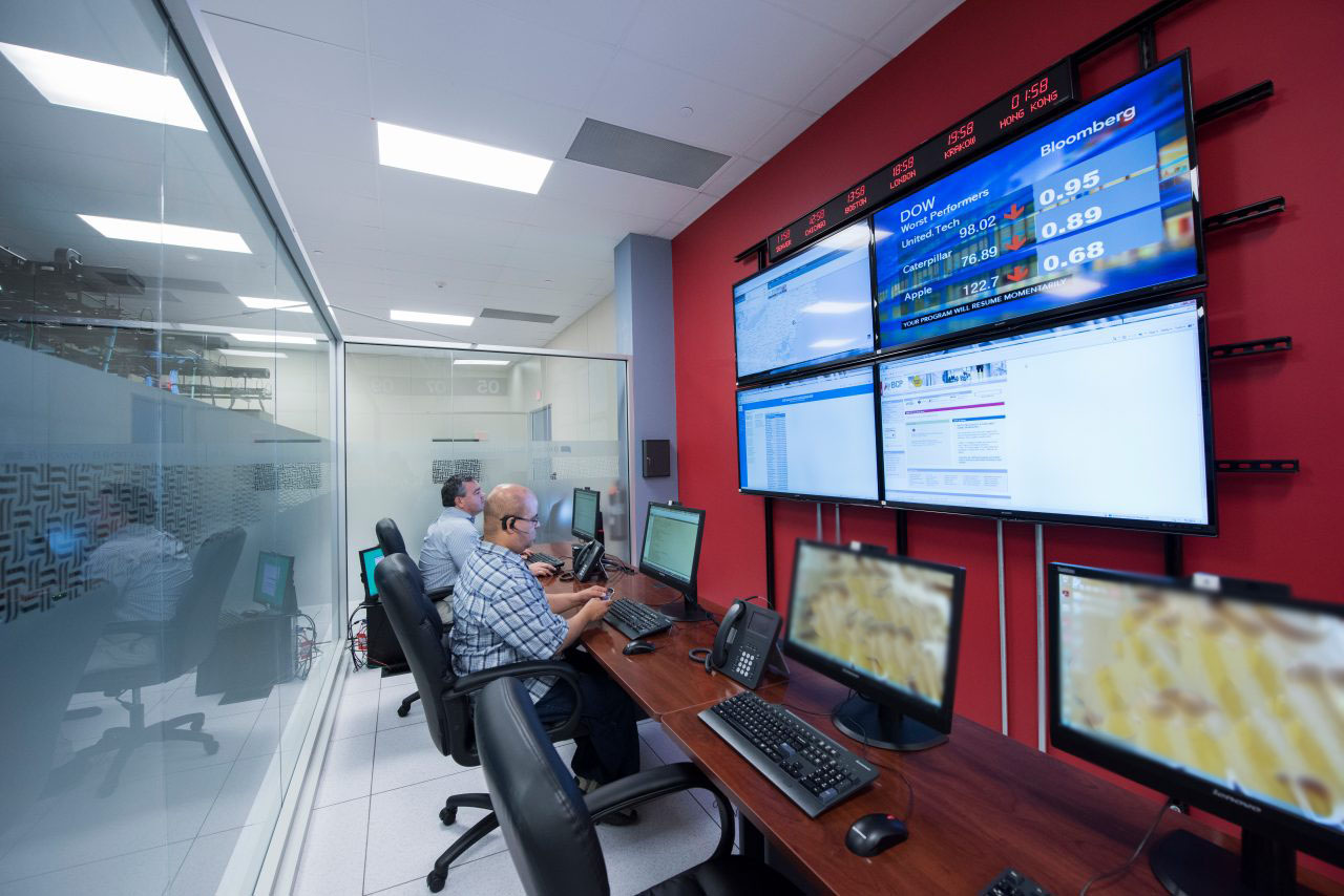 2 Seedvester Sitting at Their Computers in Data Center